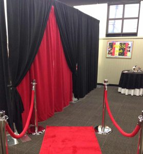 velour backdrop black and red plus red carpet and stanchions